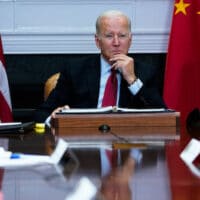 President Joe Biden listens as he meets virtually with Chinese President Xi Jinping from the Roosevelt Room of the White House in Washington, Nov. 15, 2021.