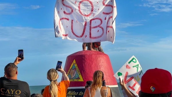 | Viral propaganda In the social media age the US anti Cuba efforts have to keep up with the way people get their information and disinformation Here protesters in Key West Fla use their phones to photograph and video a flag reading SOS Cuba from atop the Southernmost Point buoy July 13 2021 | Rob ONealThe Key West Citizen via AP | MR Online