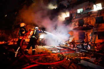 Firefighters hose down a burning building following a rocket attack on Kiev, Ukraine, Feb. 25, 2022. Photo | AP