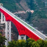 The China-Laos Railway provides a major goods transport link for ASEAN countries and China. Photo shows an electric multiple unit (EMU) high speed passenger train as it crosses a major bridge over the Yuanjiang River in southwest China’s Yunnan Province. The China-Laos Railway is a flagship project of the Belt and Road Initiative (BRI). (Xinhua/Wang Guansen)