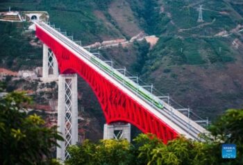 The China-Laos Railway provides a major goods transport link for ASEAN countries and China. Photo shows an electric multiple unit (EMU) high speed passenger train as it crosses a major bridge over the Yuanjiang River in southwest China’s Yunnan Province. The China-Laos Railway is a flagship project of the Belt and Road Initiative (BRI). (Xinhua/Wang Guansen)
