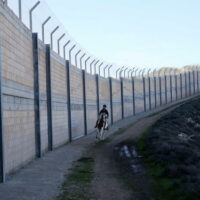 A PALESTINIAN BOY RIDES A HORSE NEAR THE SEPARATION WALL DURING AN EQUESTRIAN TRAINING AT THE PALESTINIAN EQUESTRIAN CLUB, IN RAFAT NEAR JERUSALEM ON FEBRUARY 3, 2019. PHOTO: SHADI JARAR’AH/APA IMAGES.