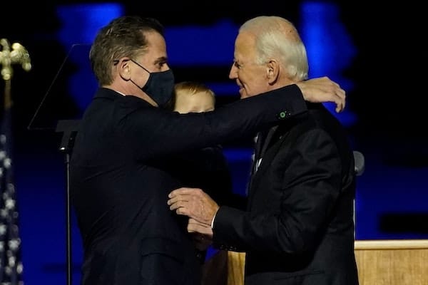 | President Joe Biden embraces his son Hunter Biden L on stage after delivering remarks in Wilmington Delaware on November 7 2020 | MR Online