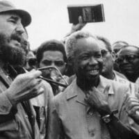 Julius Nyerere with Fidel Castro and a Cuban worker in 1977.