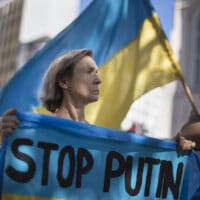 15 March 2022: Protesters gather outside Parliament in Cape Town in support of Ukraine and against Russia's invasion, calling for the government to condemn Vladimir Putin’s actions. (Photograph by Rodger Bosch/ AFP)
