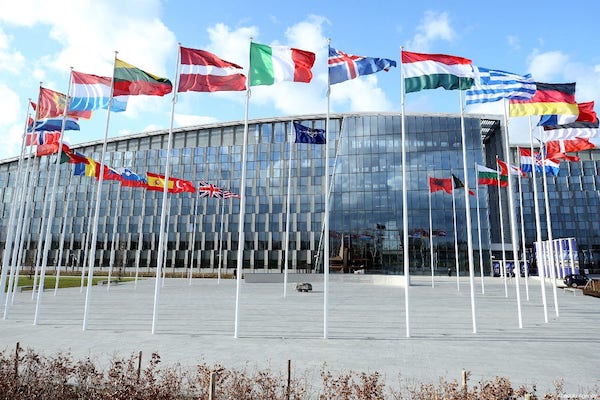 MR Online | Flags of members of North Atlantic Treaty Organization NATO wave outside of the NATO Headquarters in Brussels Belgium on 14 March 2019 Dursun AydemirAnadolu Agency | MR Online