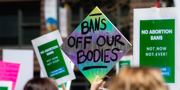 | Colourful protest sign that says Bans off our bodies Credit SHYCITYNikon flickr | MR Online