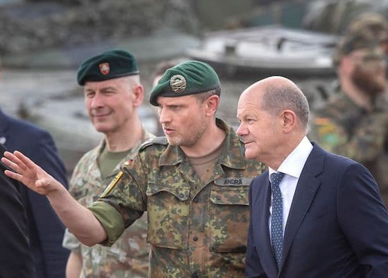 | German Chancellor Olaf Scholz right talks with Lieutenant Colonel Daniel Andrä commander of the multinational NATO Enhanced Forward Presence EFP battalion at the military training area near Prabade in Lithuania AP PhotoMindaugas Kulbis AP PhotoMindaugas Kulbis | MR Online