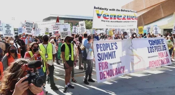 | The march about to start with Peoples Summit banner along with a banner of solidarity with Venezuela Photo Rick Sterling | MR Online