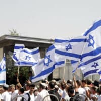| ISRAELI SETTLERS WAVE ISRAELI FLAGS NEAR DAMASCUS GATE DURING THE FLAG MARCH IN JERUSALEM ON MAY 29 2022 PHOTO JERIES BSSIERAPA IMAGES | MR Online