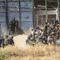 | Riot police cordon off area after people crossed fences separating the Spanish enclave of Melilla from Morocco Javier BernardoAP | MR Online