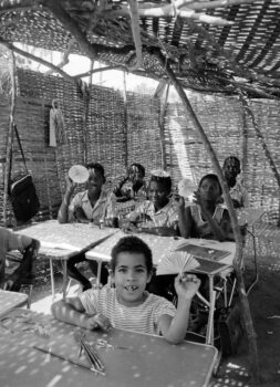 Students inside of a PAIGC classroom in a primary school in the liberated areas, 1974. Source: Roel Coutinho, Guinea-Bissau and Senegal Photographs (1973–1974)