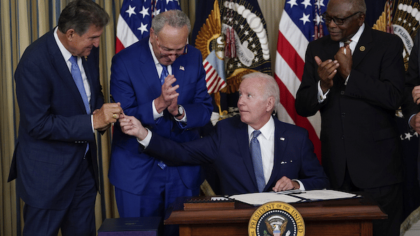 | President Joe Biden hands the pen he used to sign the Inflation Reduction Act to Sen Joe Manchin on Aug 16 2022 AP PhotoSusan Walsh | MR Online