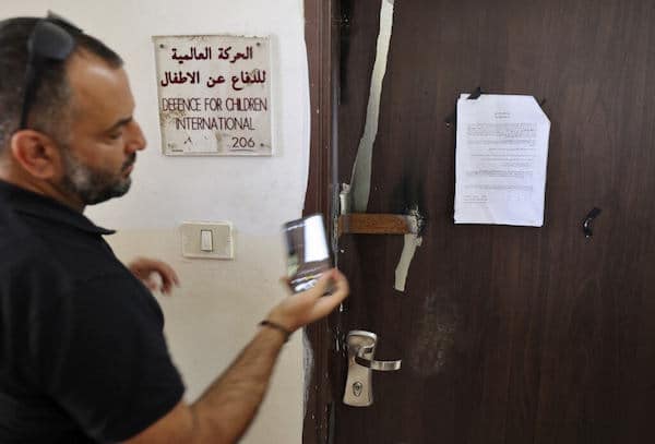 | DEFENSE FOR CHILDREN INTERNATIONAL PALESTINES OFFICE DOOR OUTSIDE RAMALLAH AFTER ISRAELI FORCES CONDUCTED A RAID AND DECLARED THE ORGANIZATION CLOSED ON AUGUST 18 2022 PHOTO CREDIT AFP ABBAS MOMANI VIA DCIP | MR Online