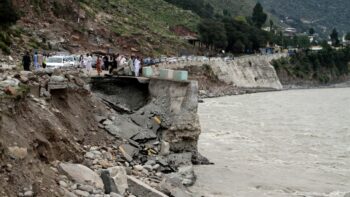 | Passengers wait by a damaged road next to floodwaters in Bahrain Pakistan Tuesday Aug 30 2022 AP PhotoNaveed Ali | MR Online