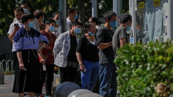 | Residents wearing face masks line up to get their routine COVID 19 throat swabs at a coronavirus testing site in Beijing Thursday Sept 22 2022 AP PhotoAndy Wong | MR Online