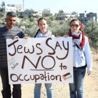 Jewish activists holding an anti Israeli occupation banner. (Photo: via Palestinian Christians Facebook Page)