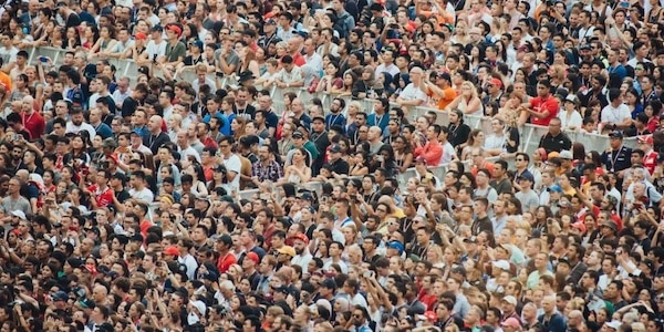 | People at a crowded concert Credit CHUTTERSNAP Unsplash | MR Online
