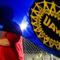 Workers walked out of the Flint Assembly Plant in the 2019 General Motors strike. In a runoff election, UAW members have elected a full slate of reformers to lead the union into this year's Big 3 auto bargaining and beyond. Photo: Jake May/The Flint Journal via AP.