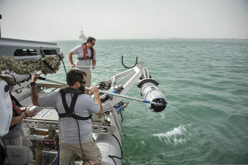  | Members of an unmanned underwater vehicle detachment with US Navy Commander Task Group CTG 561 guide a UUV as it is lowered into the water during a training exercise June 11 2013 in Bahrain Source MC1 Peter Lewis Wikimedia commons | MR Online