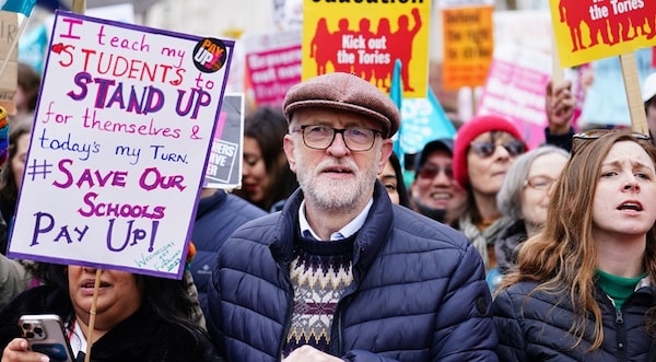 MR Online | Former Labour party leader Jeremy Corbyn joins members of the National Education Union on a march through Westminster where they are gathering for a rally against the governments controversial plans for a new law on minimum service levels during strikes | MR Online