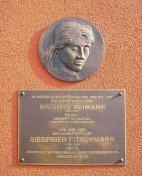 Plaque on a house at 20 Liselotte Hermann Street in Hoyerswerda recognizing the home of writers Brigitte Reimann and her husband Siegfried Pitchman  SeptemberWoman April 12 2012 licensed under the Creative Commons Attribution Share Alike 30 Unported license