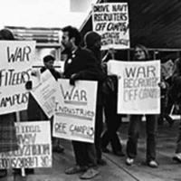 Protest against military influence at the University of Michigan during the 1960s. [Source: umich.edu]