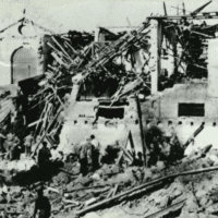 A TRUCK LOADED WITH EXPLOSIVES COVERED WITH ORANGES, PARKED OUTSIDE THE ENTRANCE OF JAFFA ‘S GRAND SERAI, WAS DETONATED BY MEMBERS OF THE LEHI-STERN GANG, DESTROYING THE BUILDING AND KILLING 26 PALESTINIAN MARTYRS, JANUARY 4, 1948. (PHOTO: INSTITUTE FOR PALESTINE STUDIES INTERACTIVE ENCYCLOPEDIA OF THE PALESTINE QUESTION)