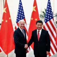 Chinese President Xi Jinping shakes hands with U.S. Vice President Joe Biden (L) inside the Great Hall of the People in Beijing December 4, 2013. REUTERS/Lintao Zhang/Pool//File Photo