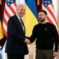 President Joe Biden (L) shakes hands with Ukrainian President Volodymyr Zelensky at the Mariinsky Palace in Kyiv on 20 February 2023 (AFP)