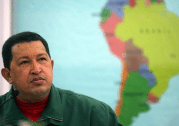 Chávez in front of a map of Latin America Instituto Simón Bolívar