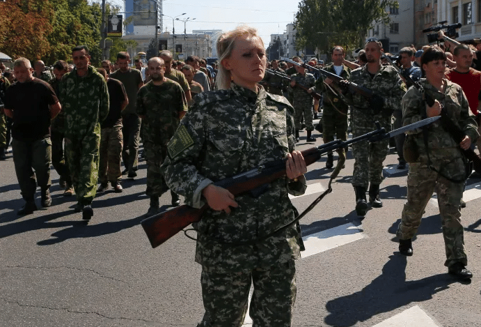 Members of the Donetsk militia escort Ukrainian prisoners of war in the Donbas The militias have been fighting the Ukrainian Army backed by the US since the war really started in 2014 Source mediumcom