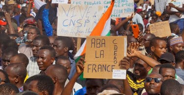 | Protesters in Niger hold signs in support of the CNSP and against France | MR Online