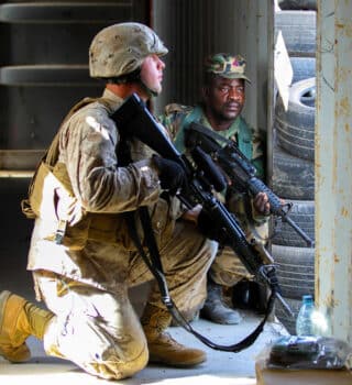 A US Army rifleman pulls security with a Ghanaian soldier during a training exercise near Camp Thies Senegal in 2014 Photo | US Army