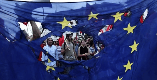 MR Online | e People protesting in Greece with a torn Europe Union flag during protests against neoliberal austerity measures in 2015 Photo APFile photo | MR Online