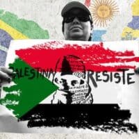  | Photo composition showing a protester holding a banner that reads Palestine resist on a Palestinian flag with a background of Latin American flags Photo The New Arab | MR Online