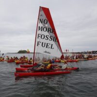 No more fossil fuels PORT OF NEWCASTLE, AUSTRALIA- On May 8 over 2,000 people shut down the world's largest coal port. For six hours no coal came in or out of the Port of Newcastle. Hundreds of kayakers blocked the harbour's entrance to any entering or exiting coal ships, whilst another 60 walked onto and shutdown the only coal transport train line into the port.