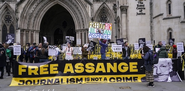 | Demonstrators hold banners outside the Royal Courts of Justice in London February 20 2024 | MR Online