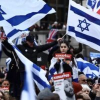 Pro-Israel supporters protest in Trafalgar Square, London, 14 January 2024 (Henry Nicholls/AFP)