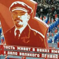 Athletes march in a parade dedicated to the sixty-third anniversary of the Great October Socialist Revolution, 7 November 1989. The banner reads: “Let the name and exploits of the great Lenin live for centuries!” Photo: IMAGO / ITAR-TASS