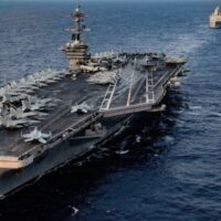 INTIMIDATION: Ships from the Theodore Roosevelt Carrier Strike Group and from the America Expeditionary Strike Group transit the South China Sea, 2020