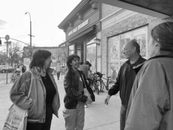 | Nitehawk workers celebrate outside the cinema with their new UAW union representative just after the victory announcementAmba Guerguerian | MR Online