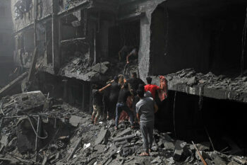 | Palestinians try to rescue survivors and pull bodies from the rubble after Israeli airstrikes hit buildings near Al Aqsa Martyrs Hospital in Deir al Balah central Gaza October 22 2023 Mohammed ZaanounActivestills | MR Online