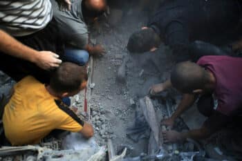 | Palestinians digging with bear hands find a dead body in the rubble after an Israeli airstrike which killed dozens Palestinians in the middle of Al Maghazi refugee camp central Gaza Strip November 5 2023 Mohammed ZaanounActivestills | MR Online