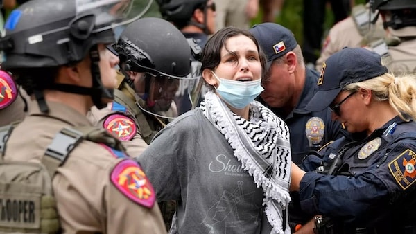 MR Online | Texas state troopers and University of Texas Police detain a woman at a pro Palestinian protest at the University of Texas on 24 April 2024 Reuters | MR Online