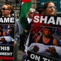 Irish citizens hold an emergency protest for Rafah outside Leinster House, on May 8, 2024, in Dublin, Ireland. Artur Widak | AP