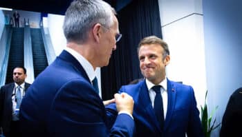 Left to right NATO Secretary General Jens Stoltenberg greeting French President Emmanuel Macron NATO