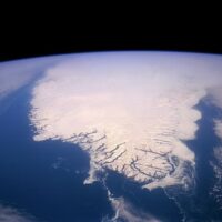 Ariel view of the shrinking Greenland ice sheet, one of four major Earth system elements that is collapsing. Photo: Wikimedia/US Geological Survey