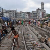 Homes beside the railroad tracks in Dhaka, Bangladesh. Dhaka is the capital of Bangladesh.