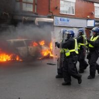 A car burns on Parliament Road, in Middlesbrough, during an anti-immigration protest, August 4, 2024